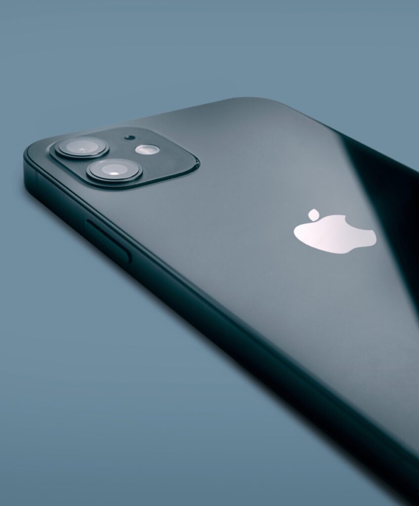 black iphone laying on a table