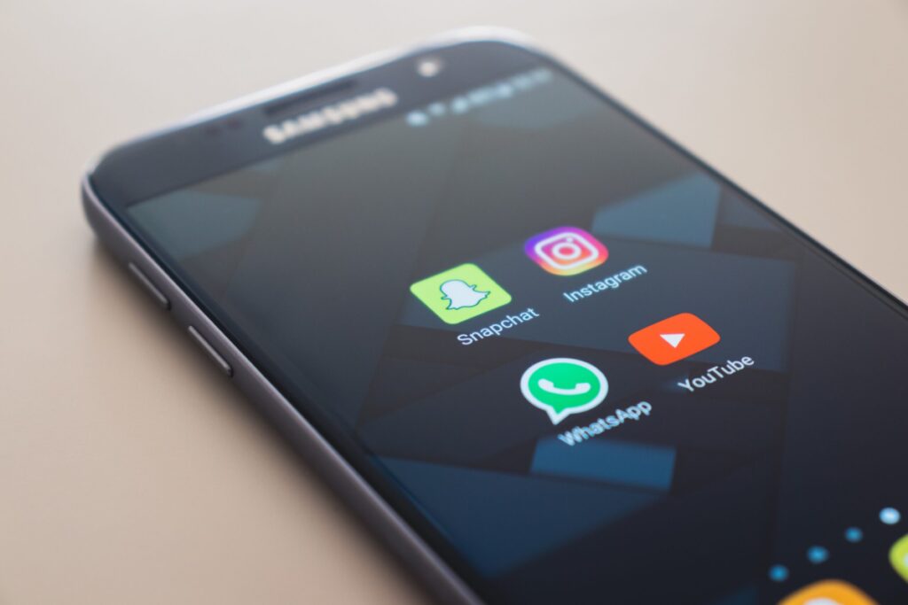 Samsung phone with social media icons