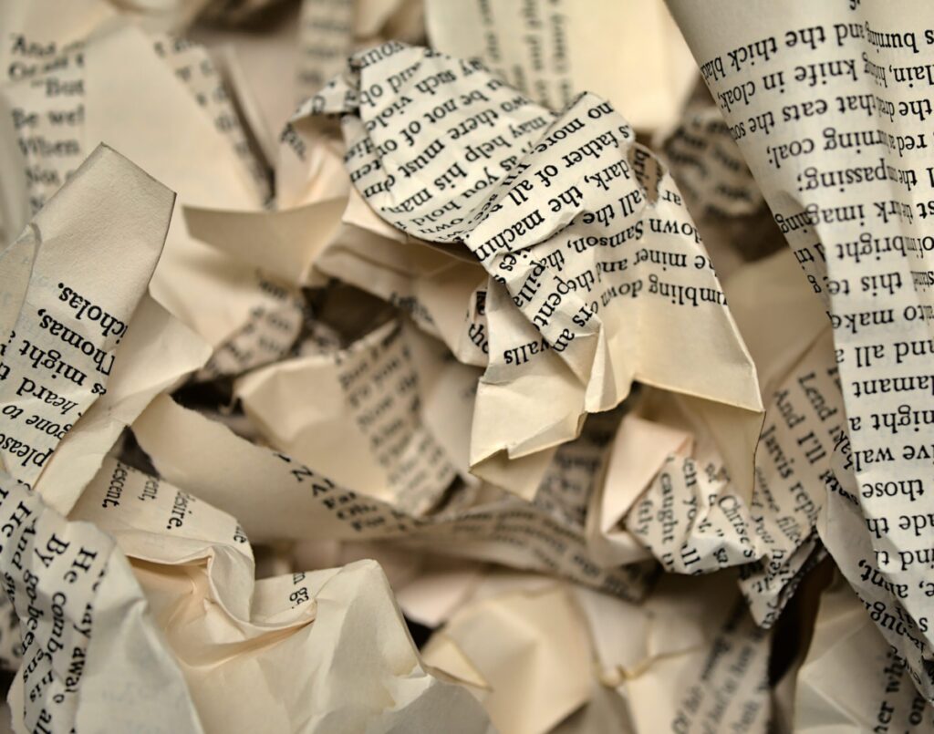 crumpled pages from a book
