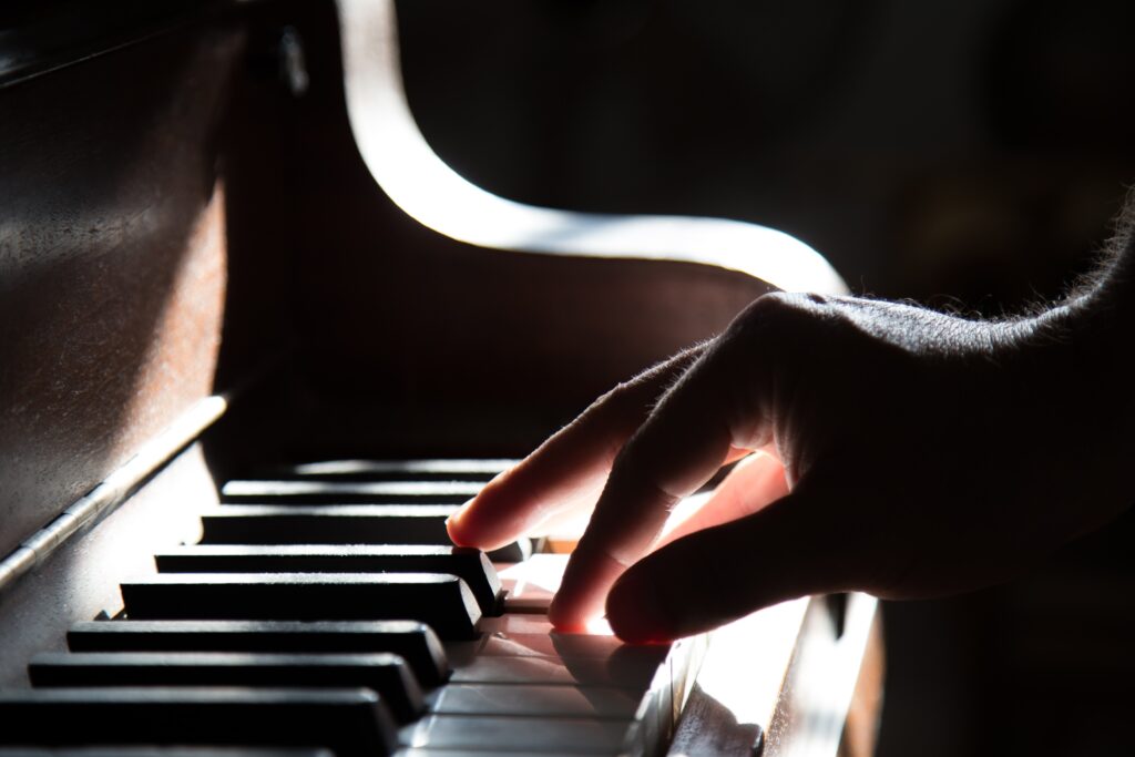 fingers on piano keys