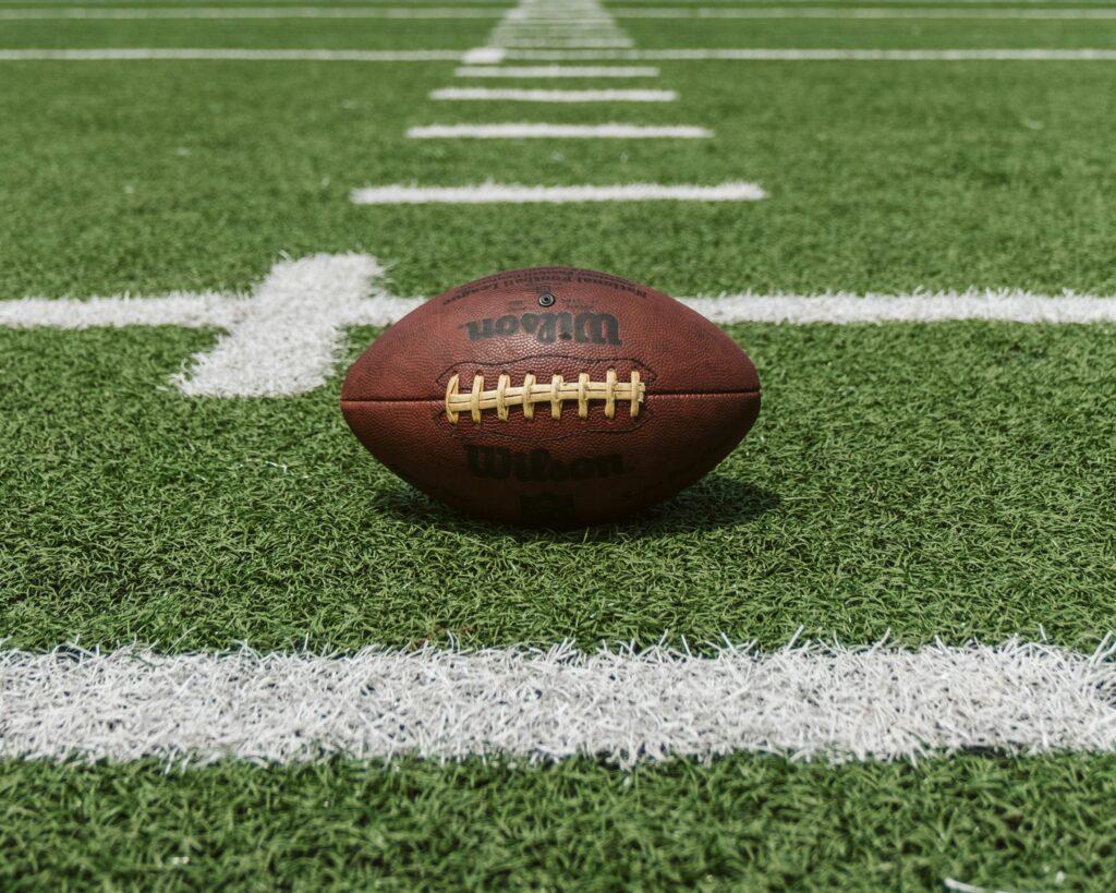 A football on an American football field.