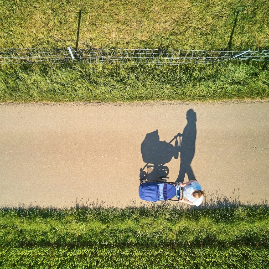A woman walking with a stroller