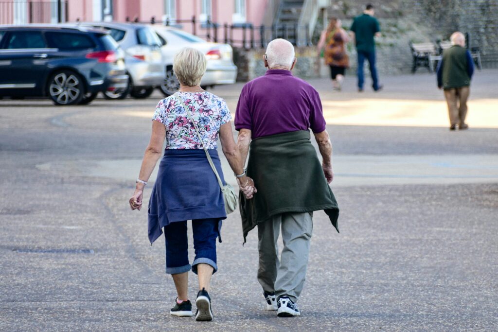 an older couple holding hands