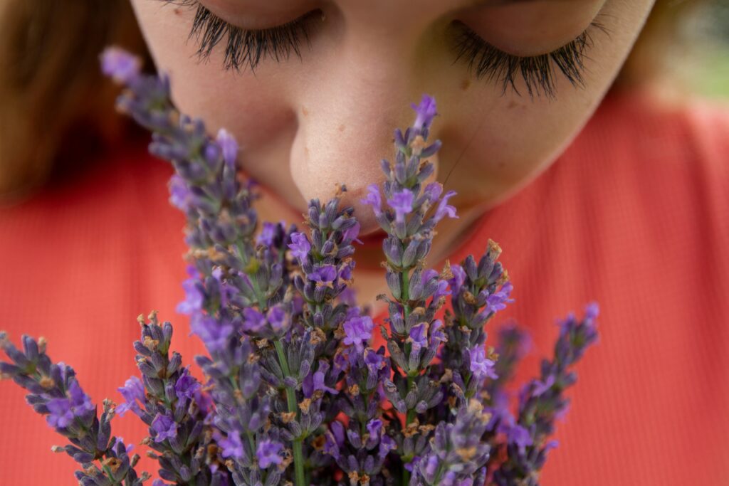 a woman smelling flowers