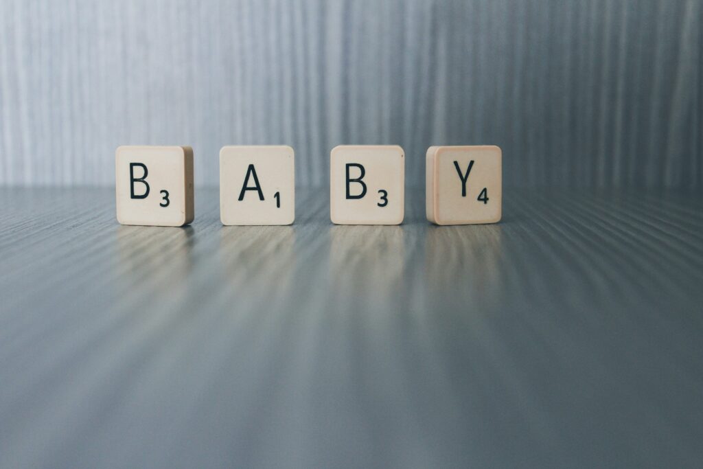 Scrabble tiles that spell B-A-B-Y